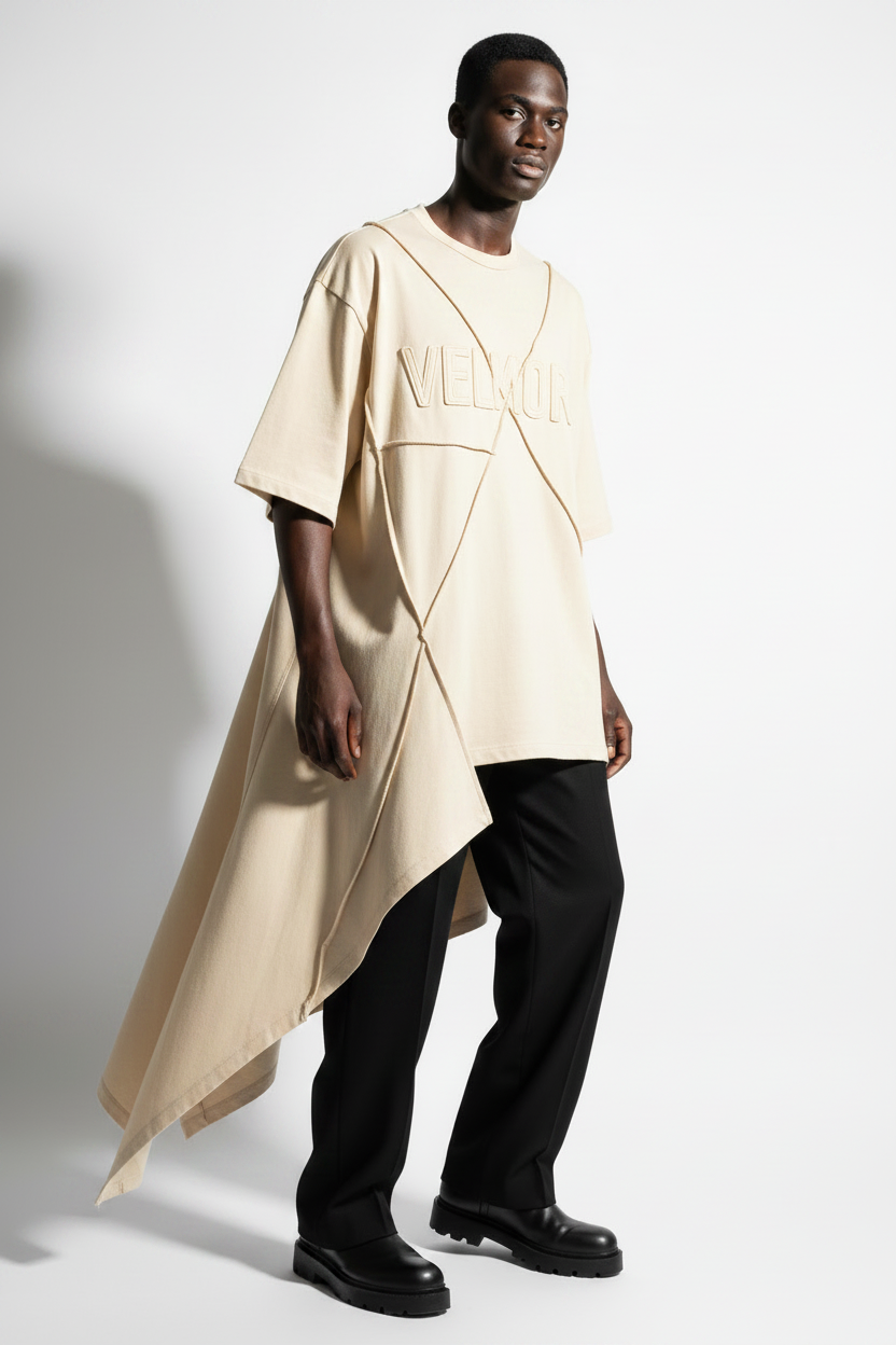VELMORI Asymmetric Sculptural Tee in ivory cream on Black male model, white background